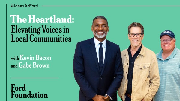 Three men, Charles Blow, Kevin Bacon, and Gabe Brown, stand against a light green background with "#IdeasAtFord" at the top left and "Ford Foundation" at the bottom left. Charles Blow is in a suit, Kevin Bacon is in a beige jacket and glasses, and Gabe Brown is in a striped polo shirt and cap.