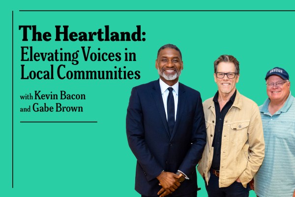 Image of three men standing in front of a turquoise background with text. The text reads: "The Heartland: Elevating Voices in Local Communities with Kevin Bacon and Gabe Brown." The man on the left is in a black suit, the middle man wears glasses and a beige jacket, and the man on the right wears a baseball cap and a striped polo shirt.