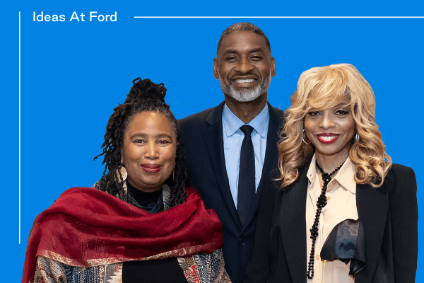 Three people standing together, two women, Aishah Shahidah Simmons, and Stephanie "Sparkle" Edwards, and one man, Charles Blow posing and smiling against a blue background with the text "Ideas At Ford" in the top left.